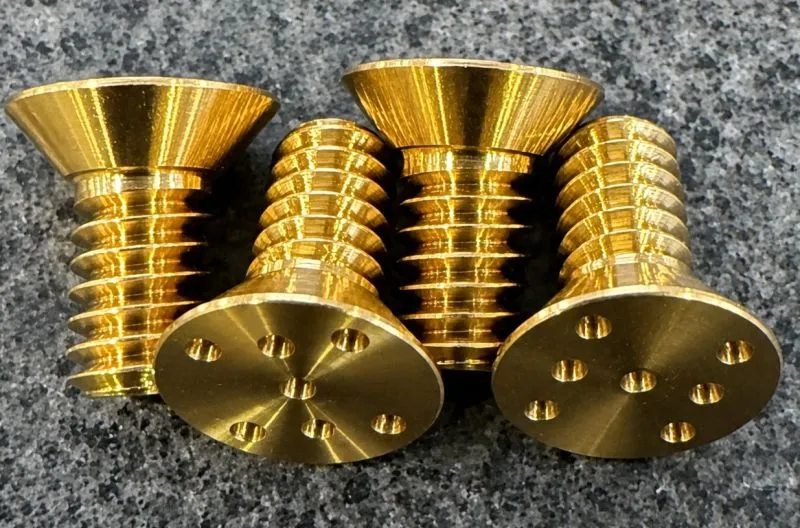 1/4"-20 UNC-3A × 1/2" Spanner Flat Head Screw in ASTM B21 Grade 464 — machined by Innovation Fasteners, Houston