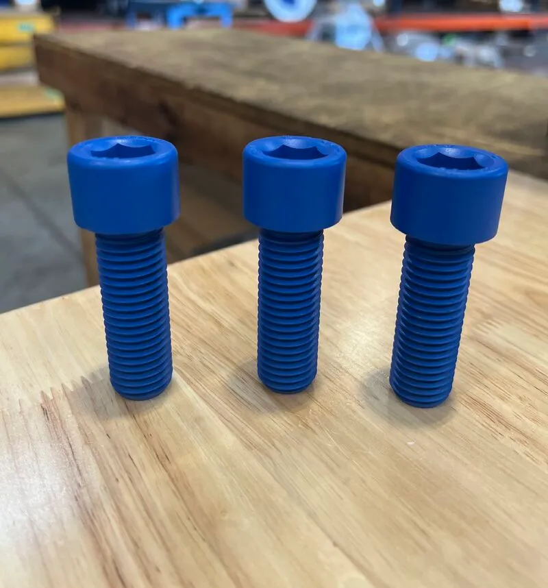 3/4"-10 UNC-2A x 2-1/4" Socket Head Cap Screw in ASTM A193 Grade B7, Xylan 1424 Blue coating — machined by Innovation Fasteners, Houston