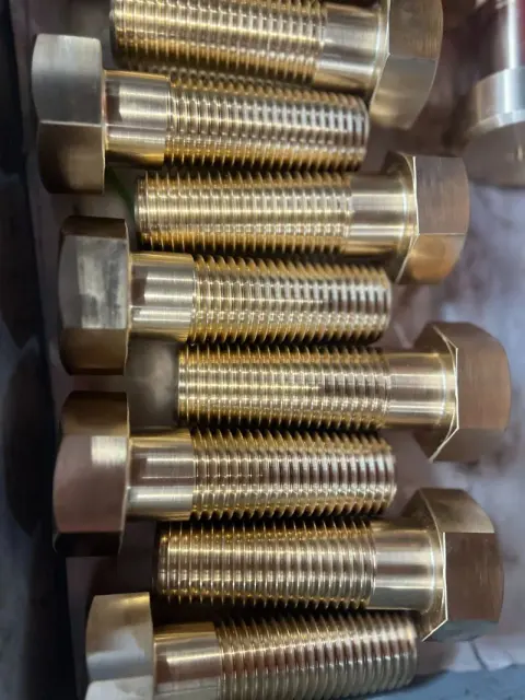 1-1/2"-6 UNC-2A x 4-1/2" Hex Cap Screws in Aluminum Bronze — machined by Innovation Fasteners, Houston