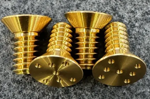 1/4"-20 UNC-3A × 1/2" Spanner Flat Head Screw in ASTM B21 Grade 464 — machined by Innovation Fasteners, Houston
