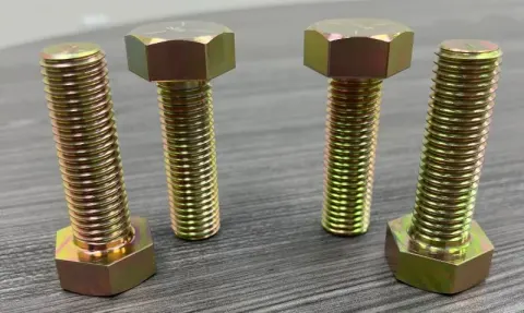 3/4"-10 UNC x 2-1/2" Heavy Hex Bolt in SAE J429 Grade 5, yellow chromate zinc (ASTM B633 Type II Fe/Zn8) — machined by Innovation Fasteners, Houston