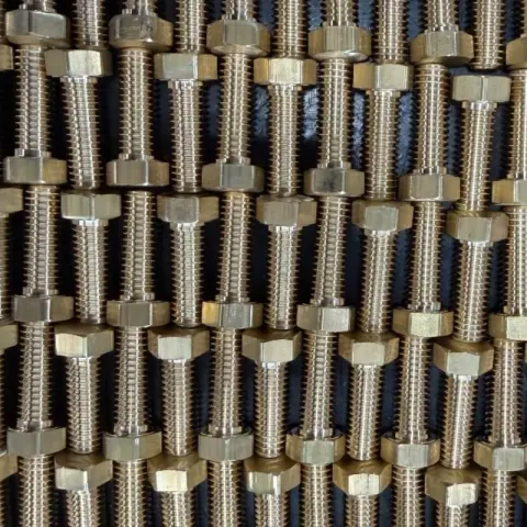 7/16-14 UNC-2A x 1-1/4" Hex Head Cap Screw in ASTM B21 Alloy C46400 — machined by Innovation Fasteners, Houston